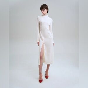 Unworn, tags on white dress with thigh slit